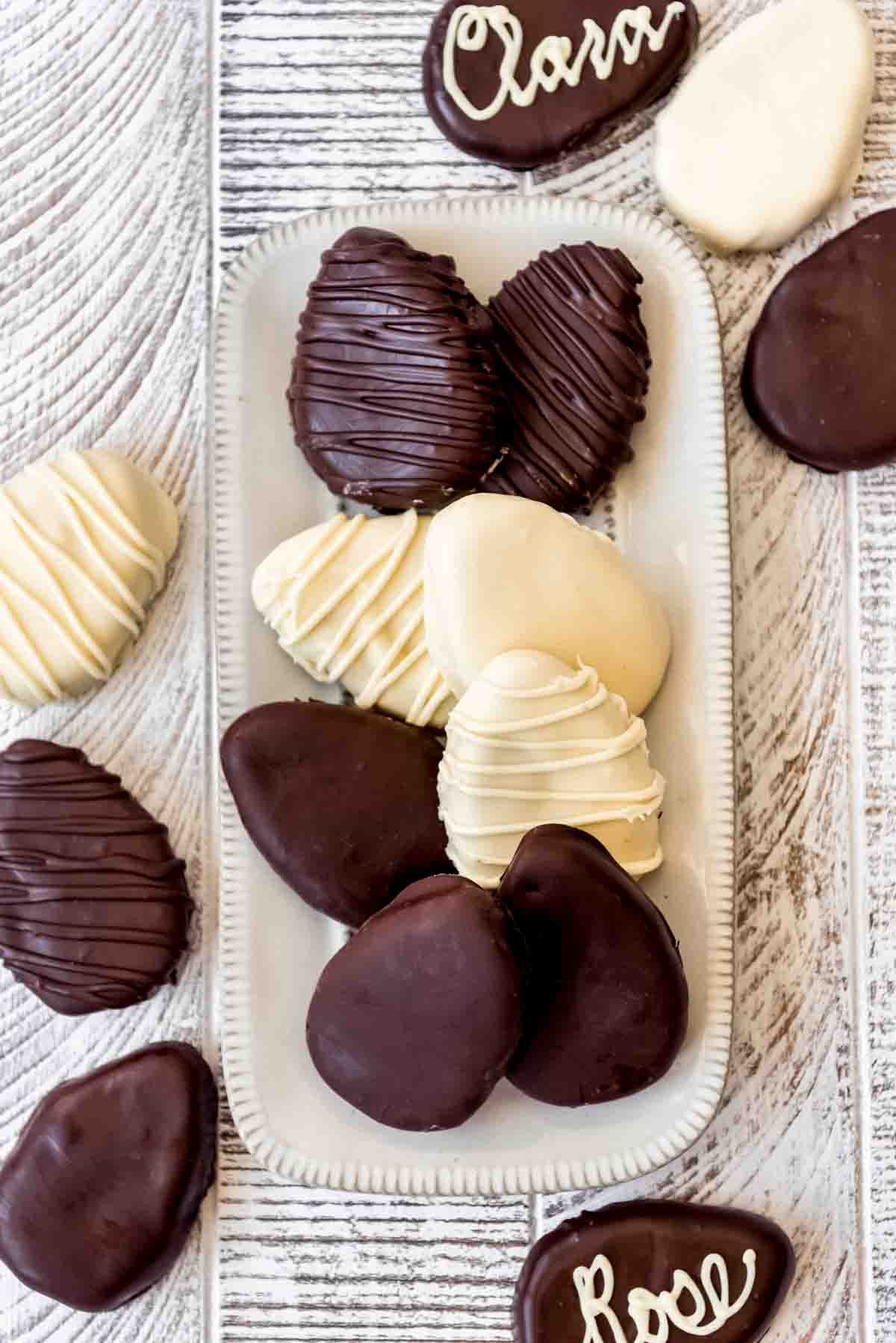 Homemade chocolate peanut butter eggs on a serving plate.