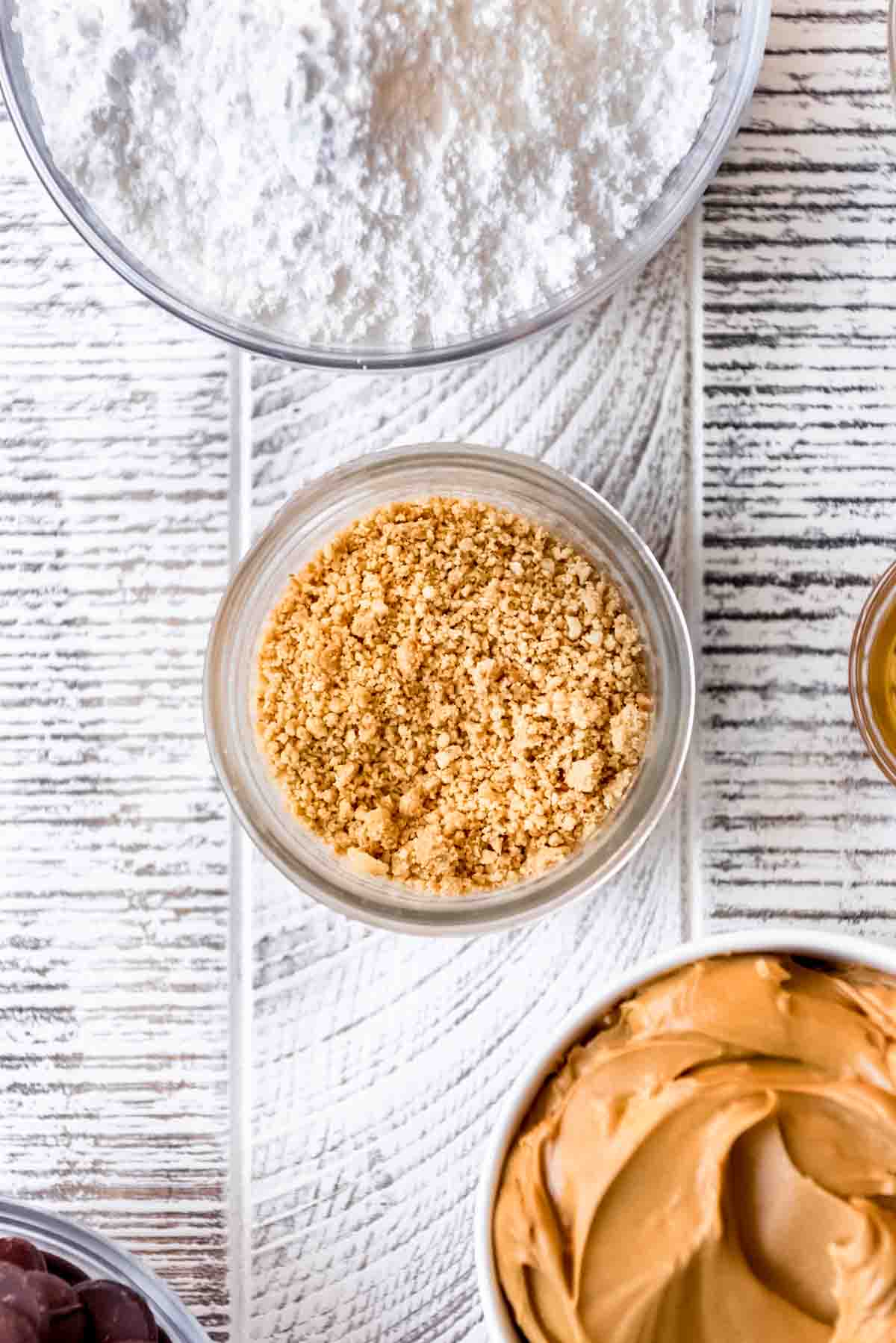 Finely ground peanuts in a glass bowl.