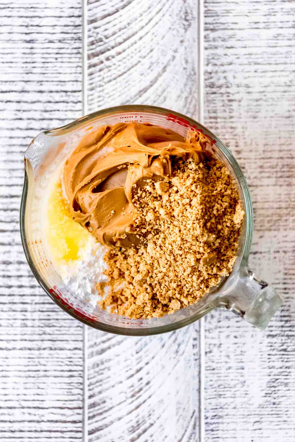 A mixing bowl with peanut butter filling ingredients.