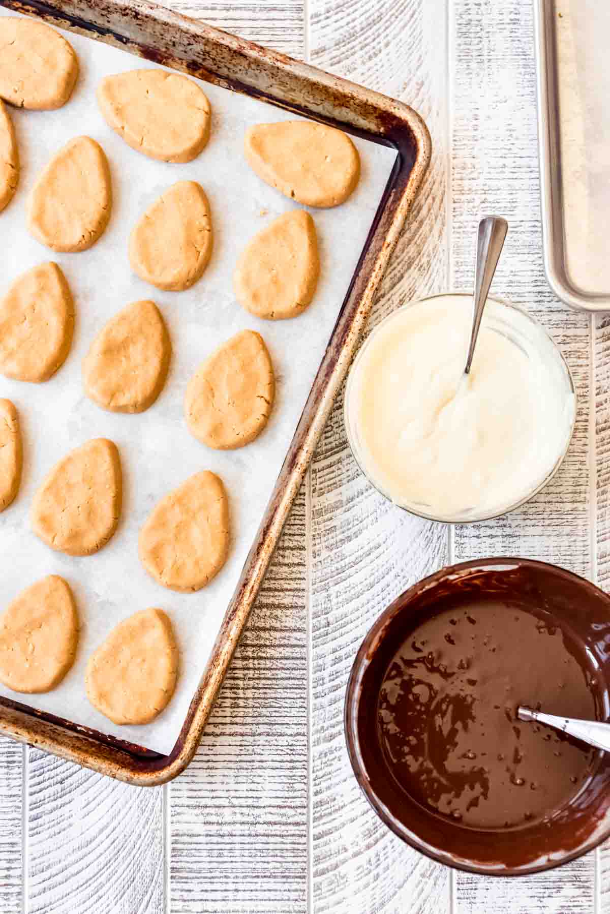 Chilled peanut butter eggs ready for dipping in melted white or dark chocolate.