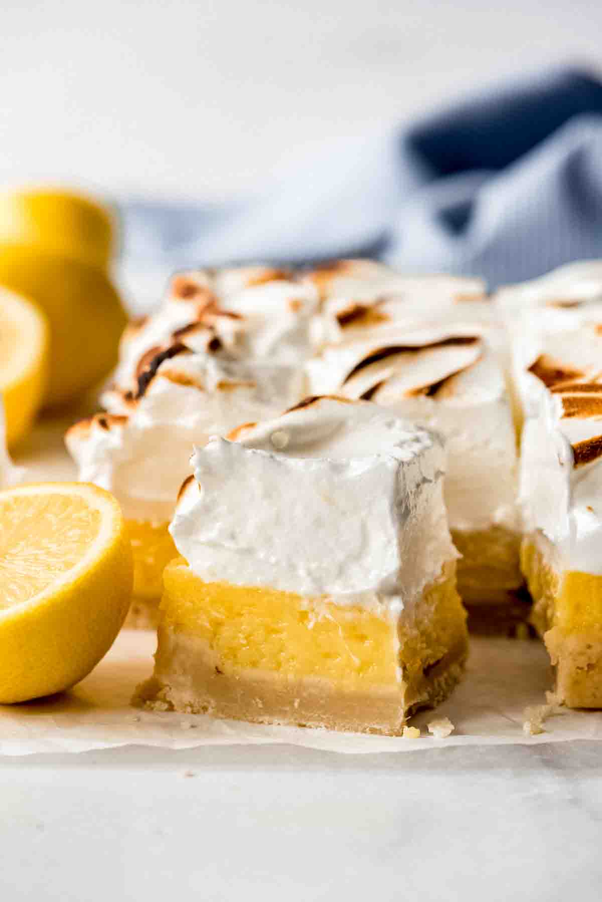 A square lemon bar topped with meringue.