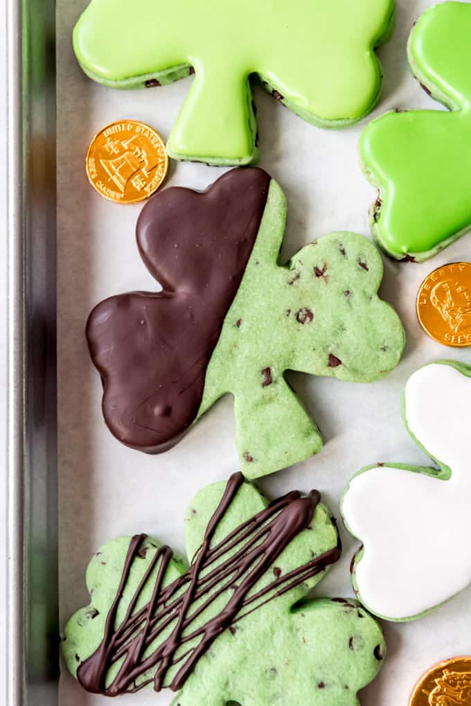Chocolate dipped mint chocolate chip cut out cookies.