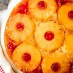 a from scratch pineapple upside down cake with pineapple and cherries
