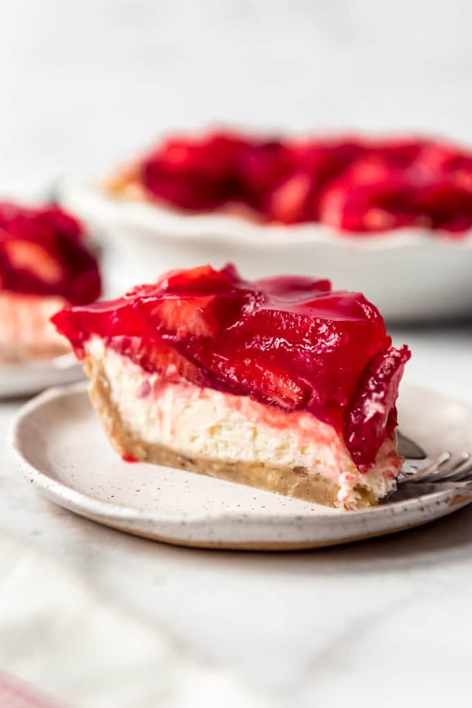 a slice of strawberry cream cheese pie on a plate