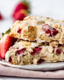 a close image of bits of strawberries in glazed scones