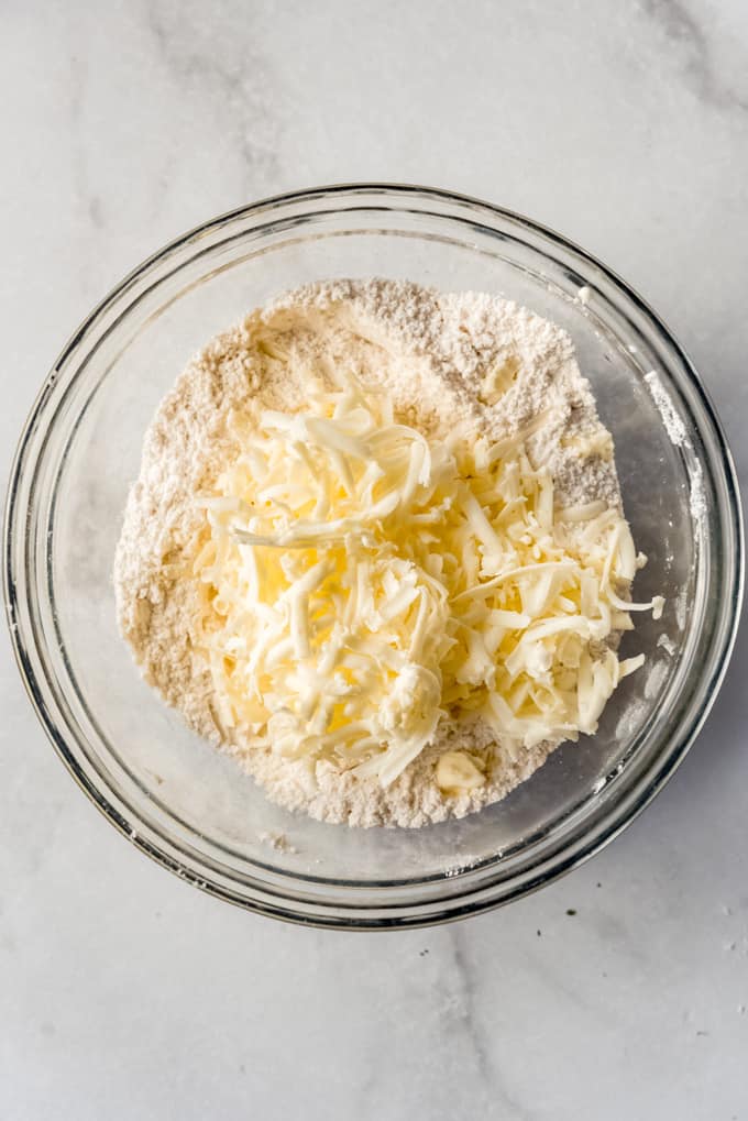 adding grated butter to scone dough
