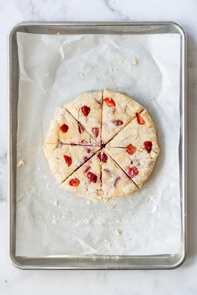 a disc of scone dough sliced into eighths