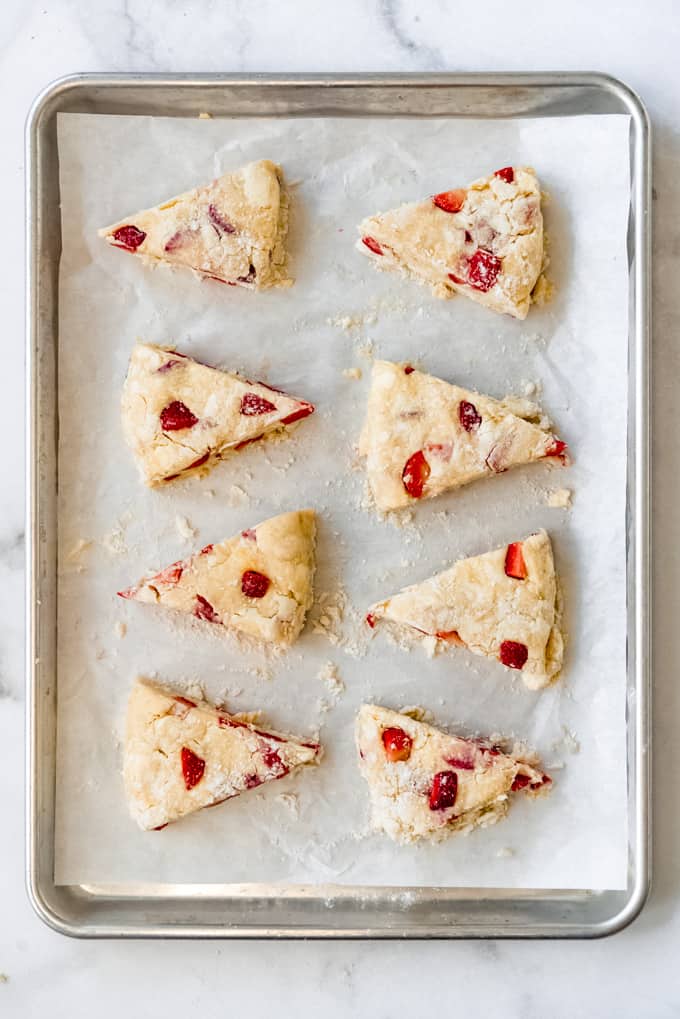 unbaked strawberry scone dough cut into wedges