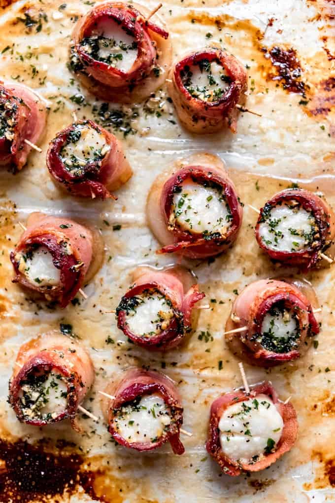 Bacon wrapped scallops right out of the oven on a baking sheet