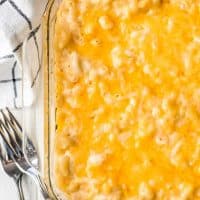 a close image of melted cheddar cheese on top of baked macaroni