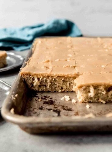 A side image of banana sheet cake covered in penuche frosting.