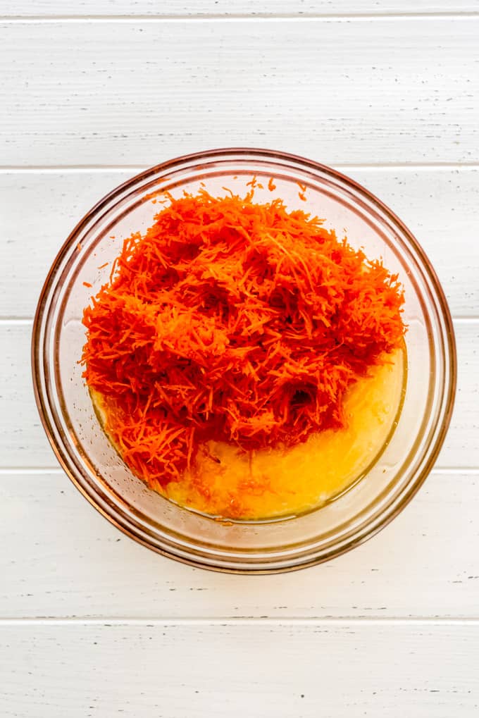 adding shredded carrots to wet ingredients