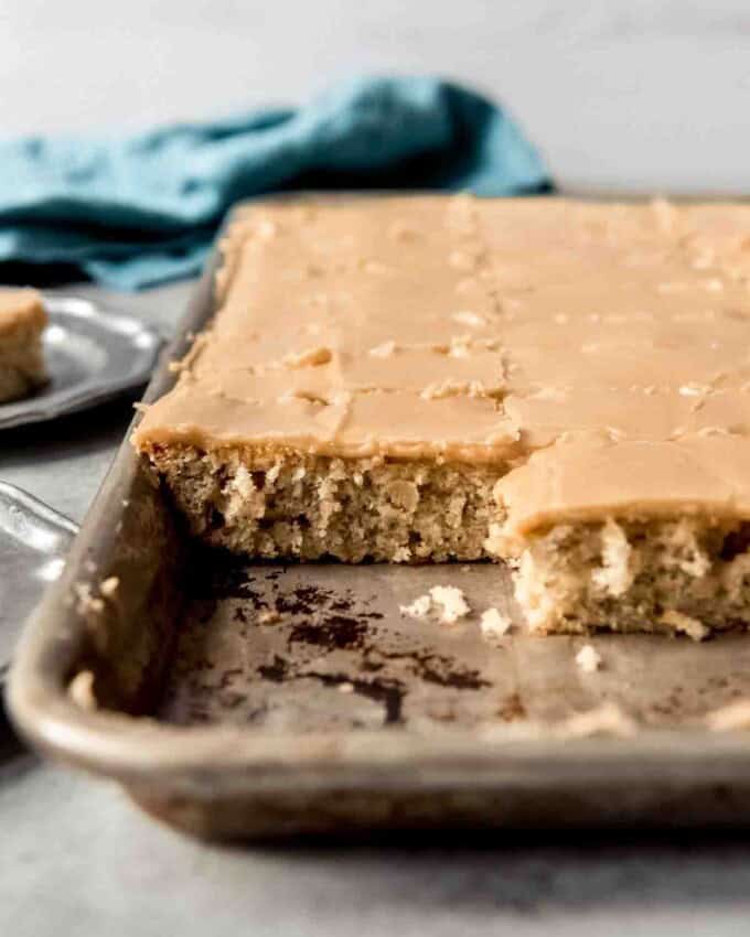 A side image of banana sheet cake covered in penuche frosting.