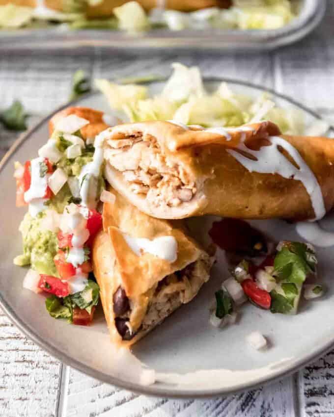 Appetizer sized flautas on a plate.