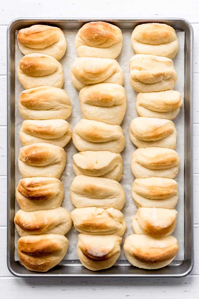 parker house rolls baked on baking sheet with parchment paper