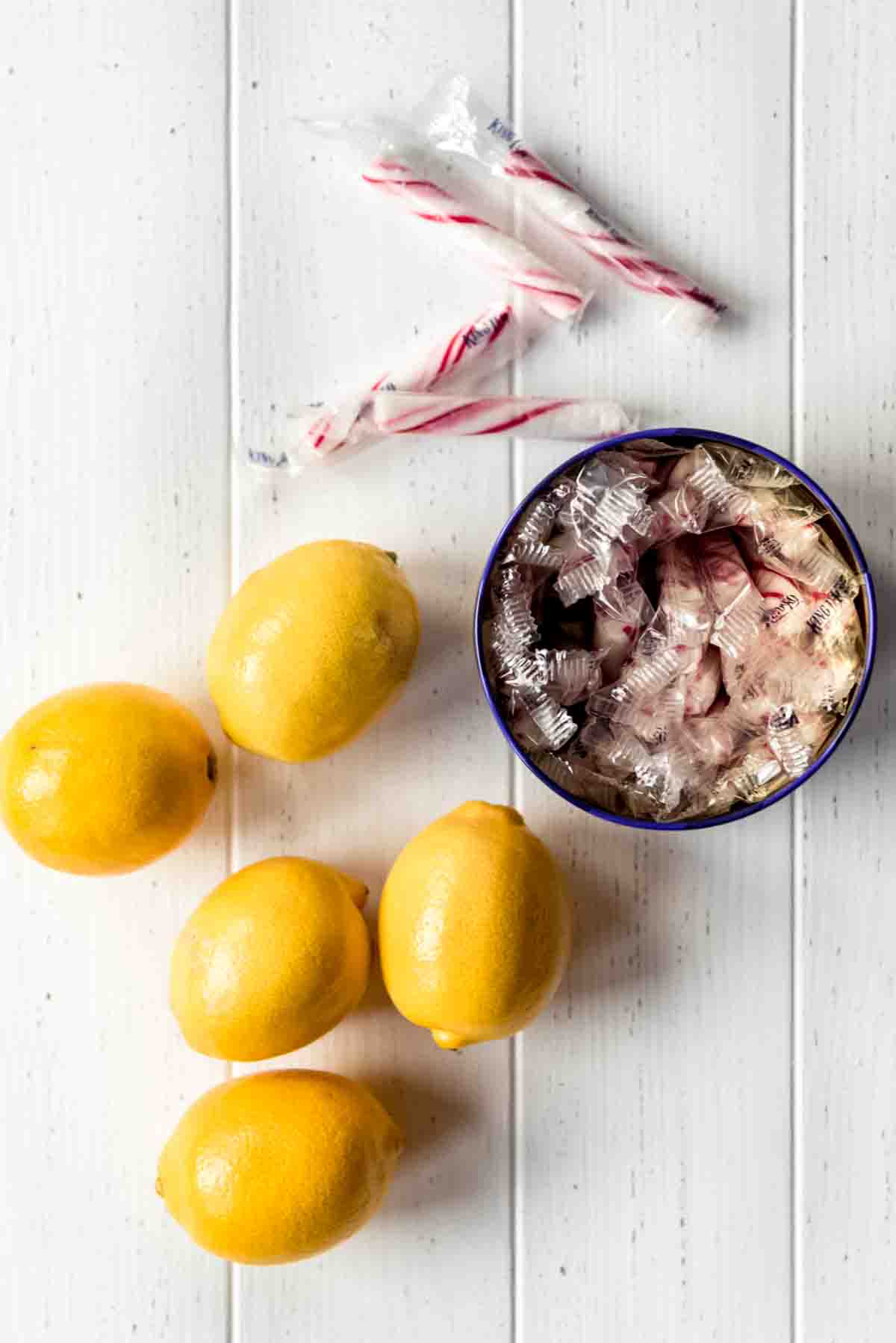 Whole lemons and King Leo peppermint sticks in a tin.