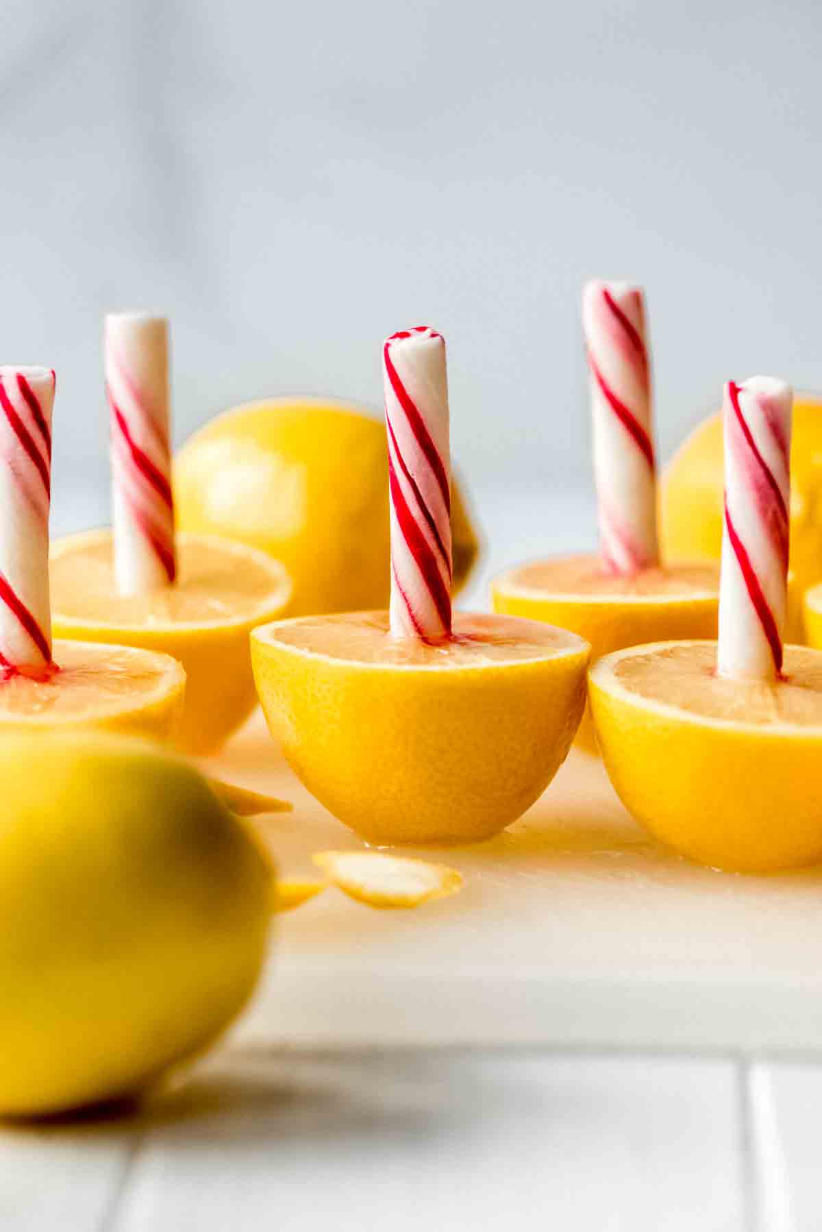 Lemon peppermint sticks on a cutting board.