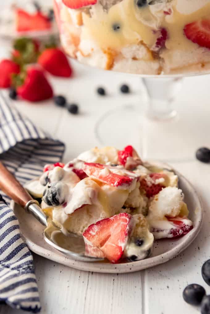 a scoop of a berry fruit trifle on a dessert plate