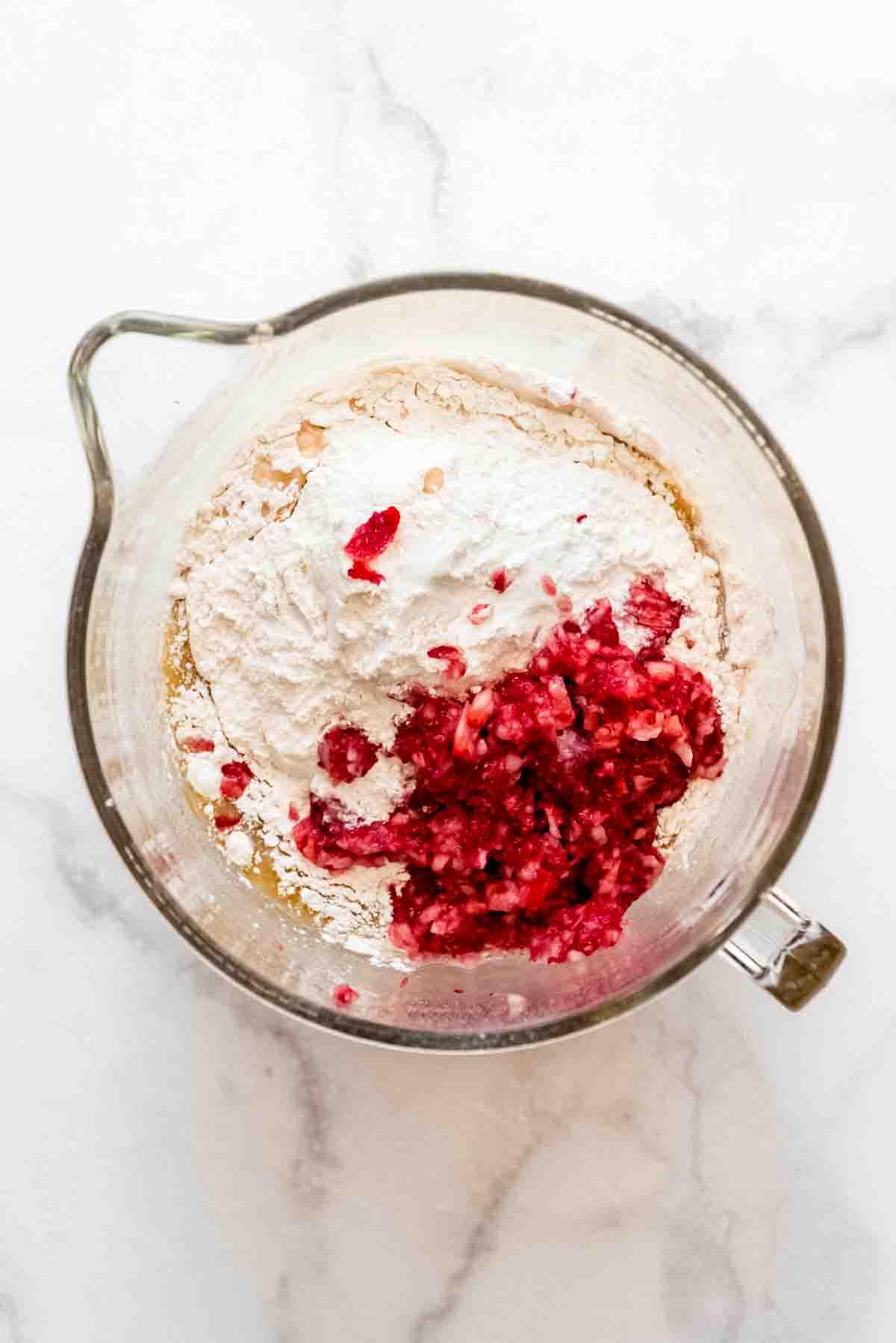 Finely chopped strawberries and flour are added to the other ingredients for strawberry whoopie pies. 