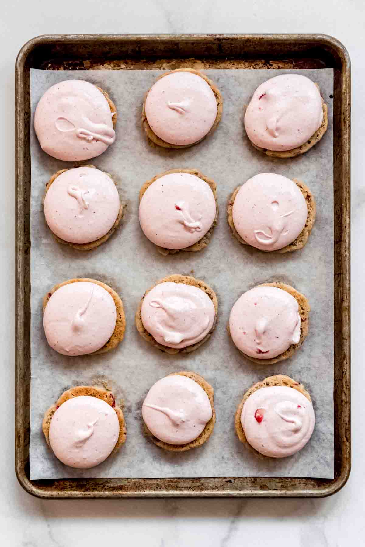 Strawberry marshmallow filling on whoopie pie shells.