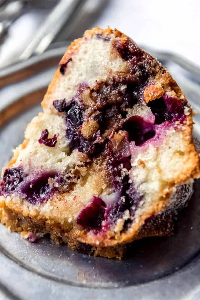 A slice of Blueberry Sour Cream Coffee Cake on a plate