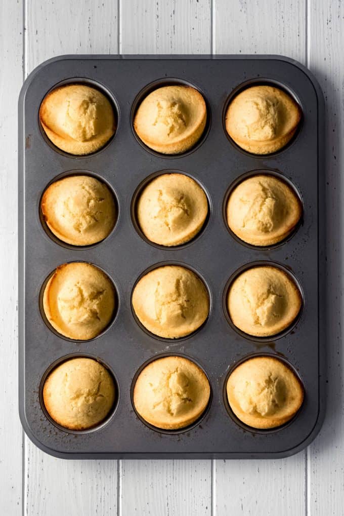 a muffin tin filled with corn muffins