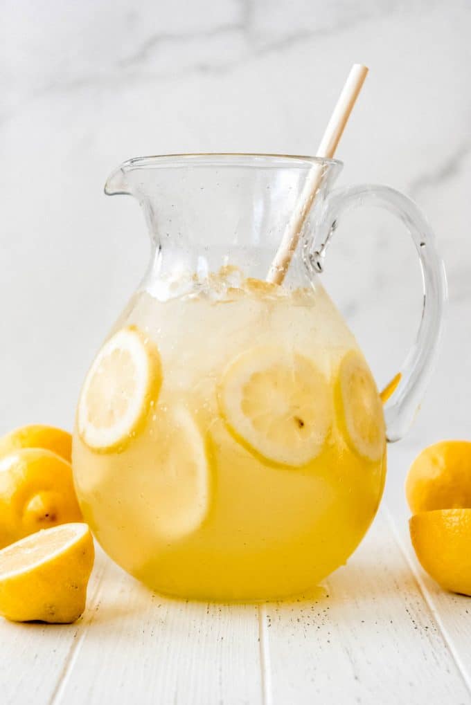 a glass pitcher filled with homemade lemonade