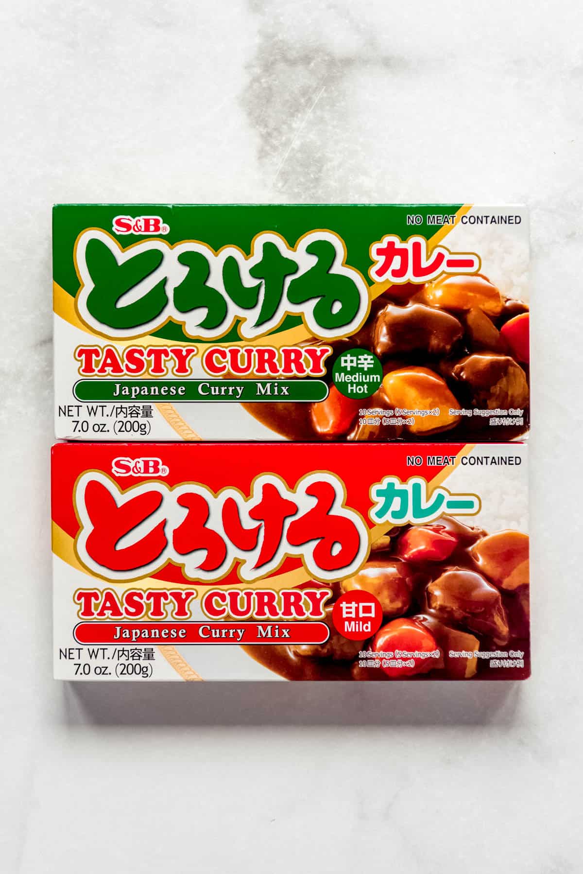 Boxes of curry mix in mild and medium hot varieties. 