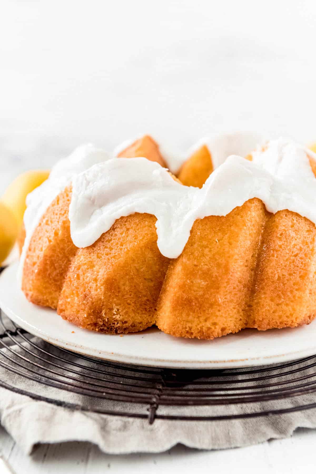 a close image of lemon bundt cake with lemon glaze