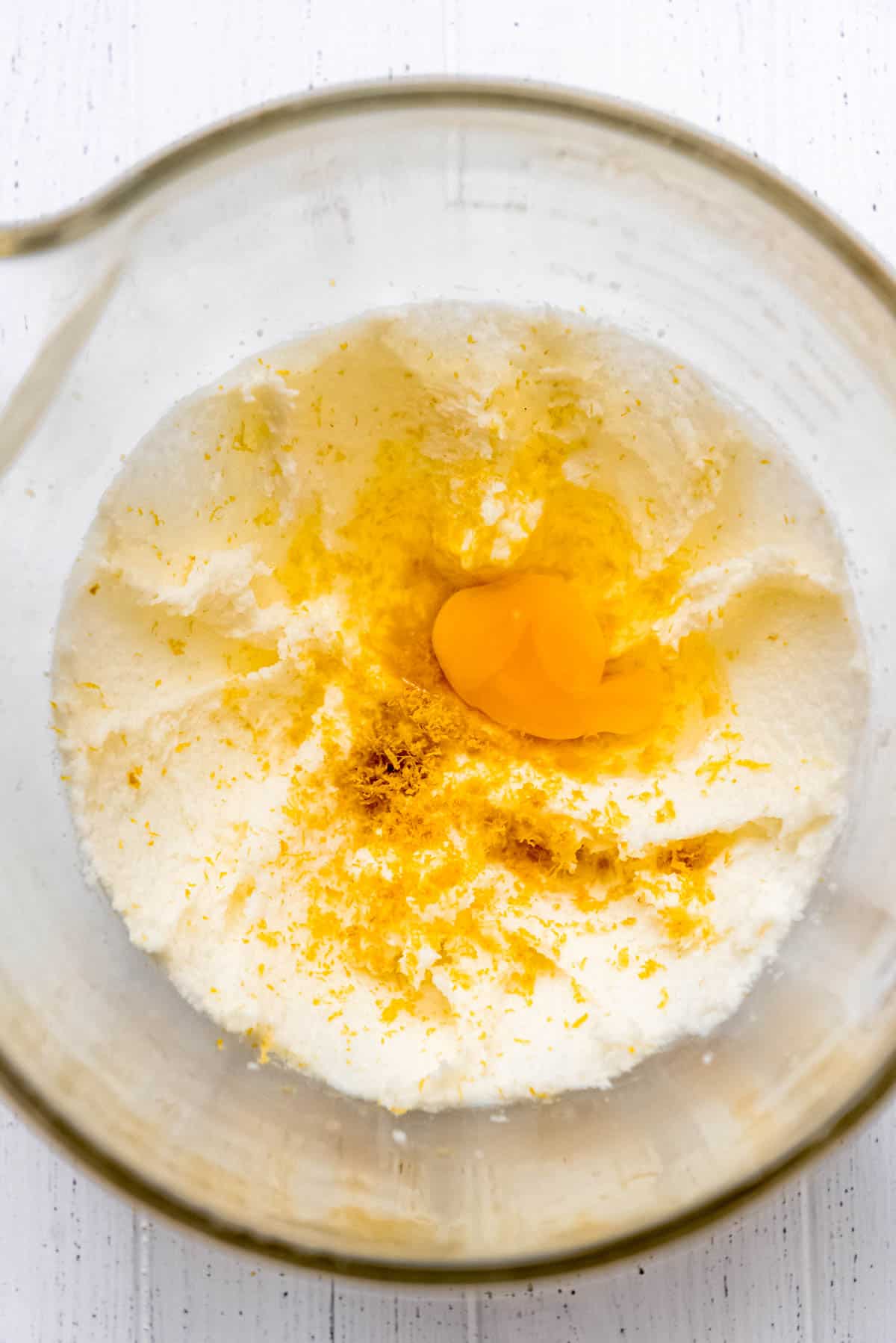 Lemon zest, lemon juice and egg are added to the creamed butter and sugar mixture. 