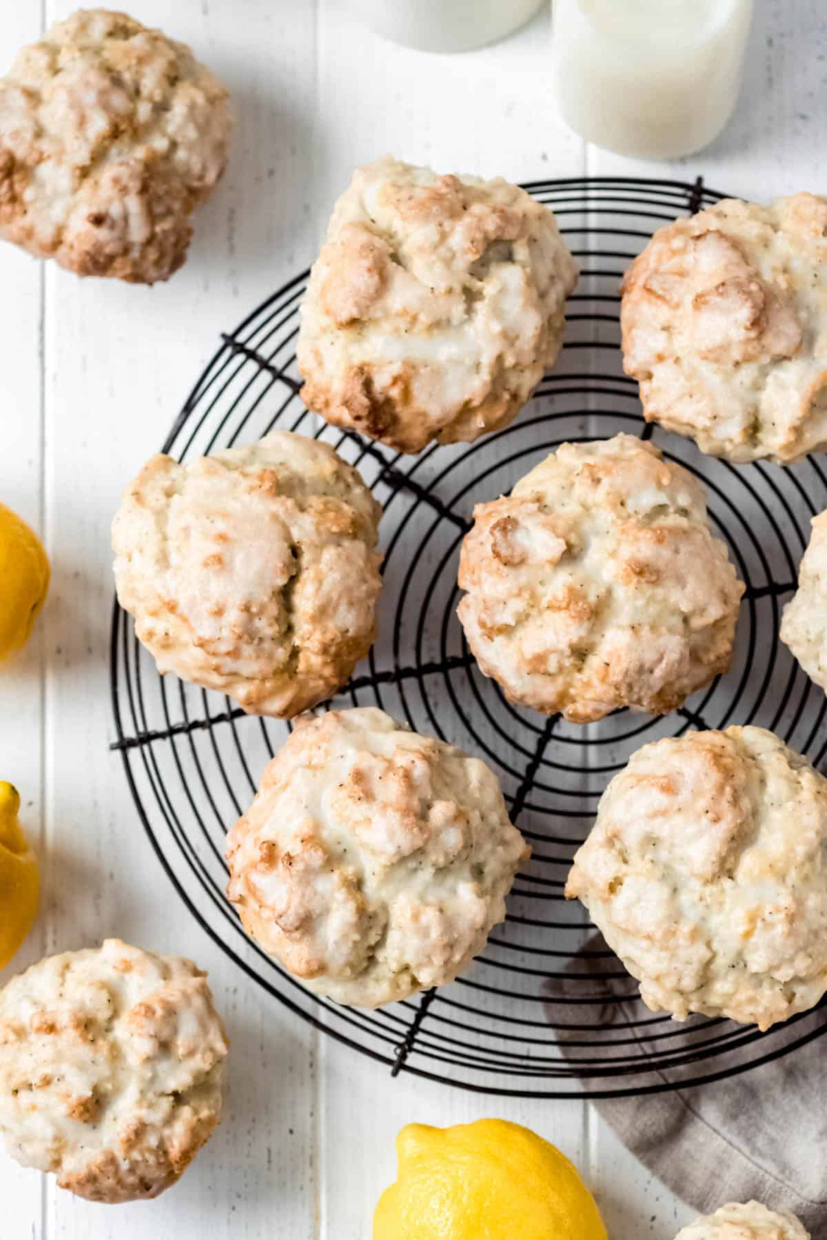 the glazed tops of lemon poppy seed muffins on a round wire cooling rack