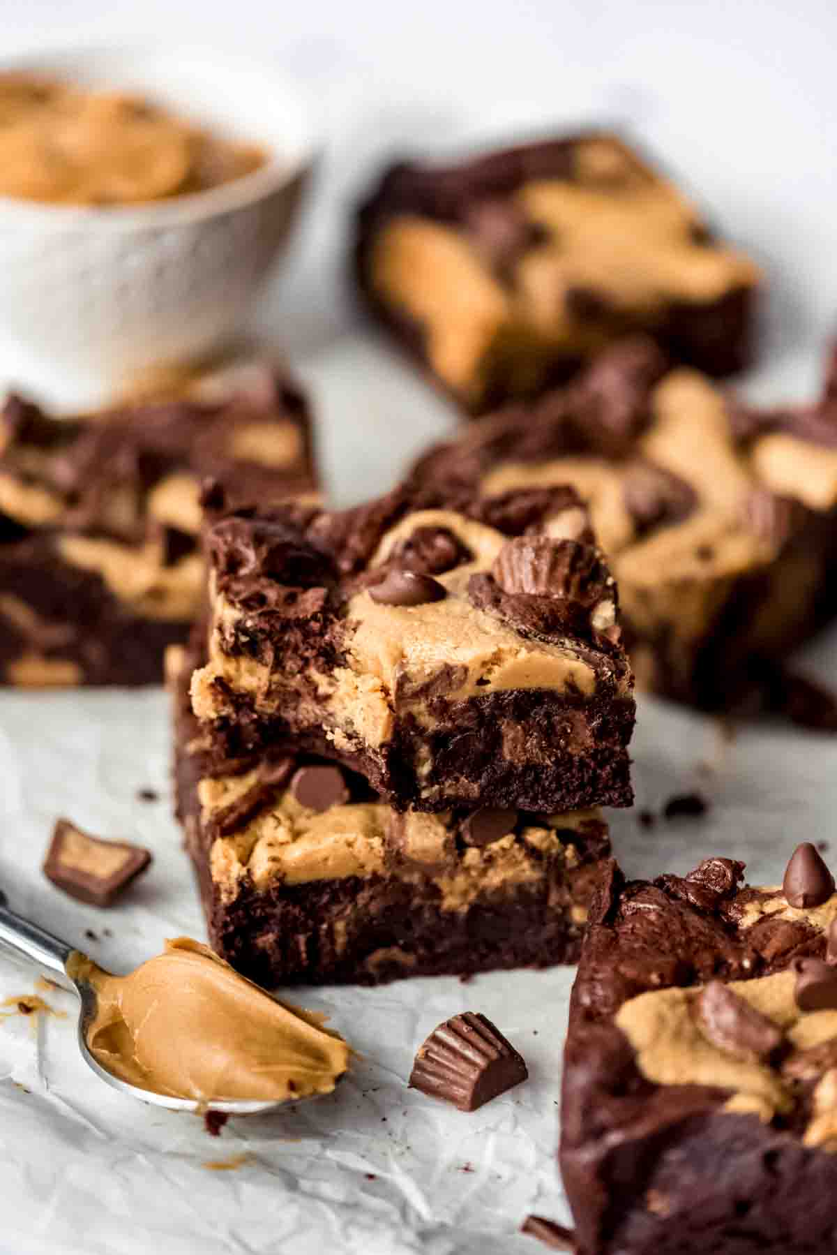 Two Peanut Butter Swirl Brownies stacked on top of each other, bite missing from one brownie.