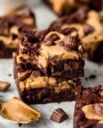 Two Peanut Butter Swirl Brownies stacked on top of each other, bite missing from one brownie.