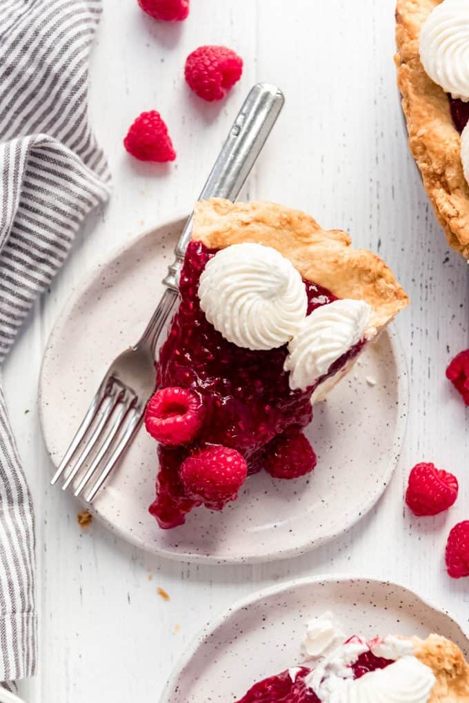 a slice of raspberry cream pie on a plate