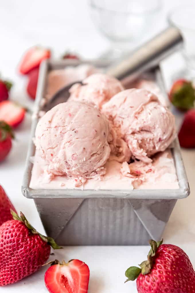 a bread pan filled with strawberry ice cream