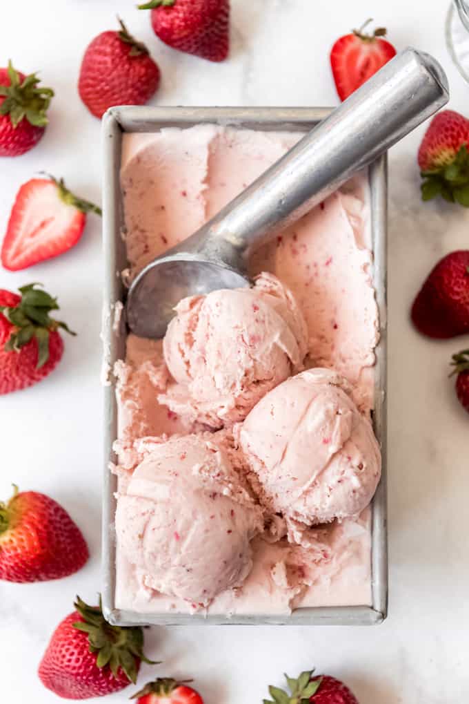 scooped strawberry ice cream in a freezer-safe container