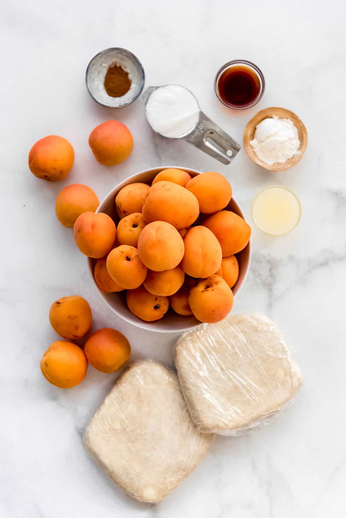 apricot pie ingredients on a marble surface