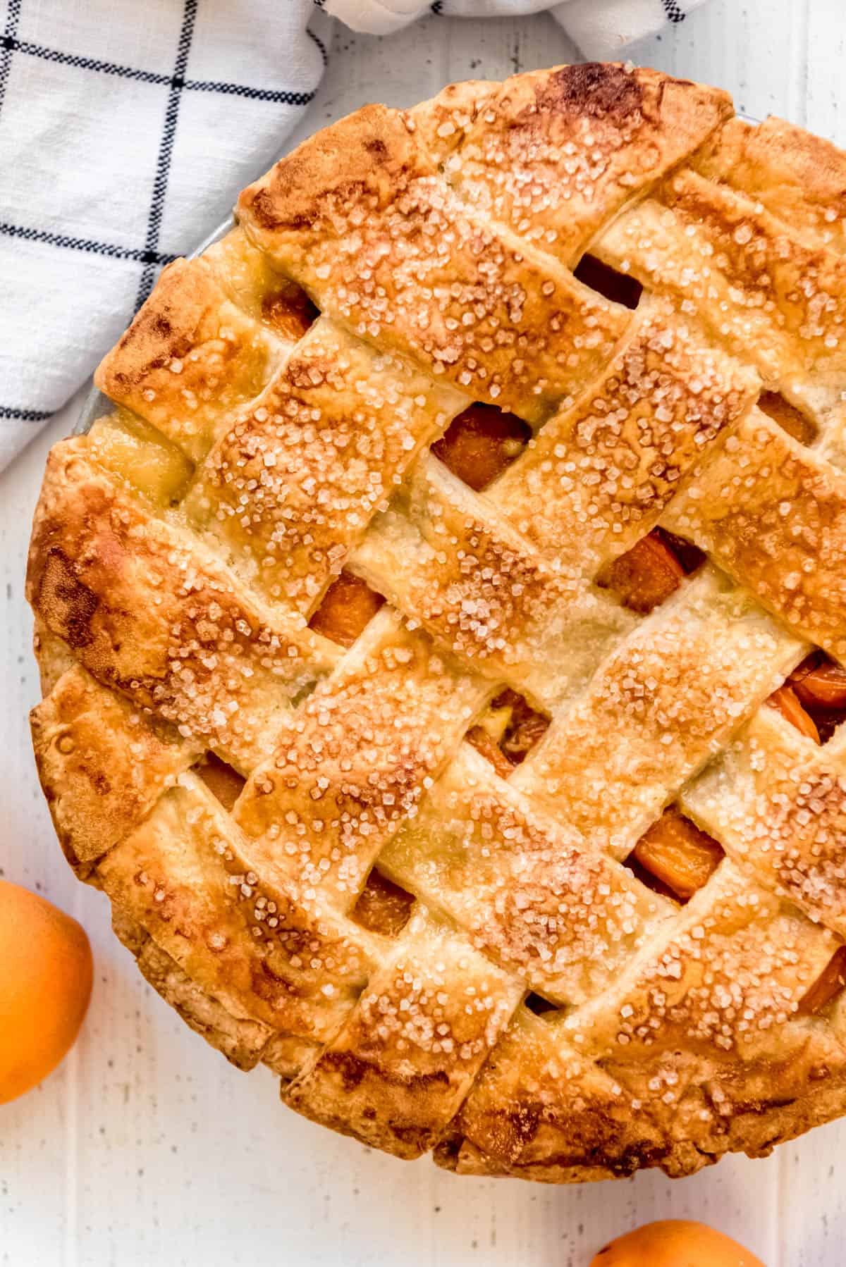 a lattice pie crust sprinkled with coarse sugar