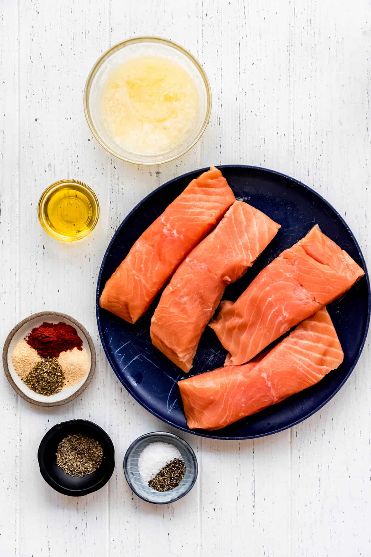 butter, olive oil, spices, and salmon fillets