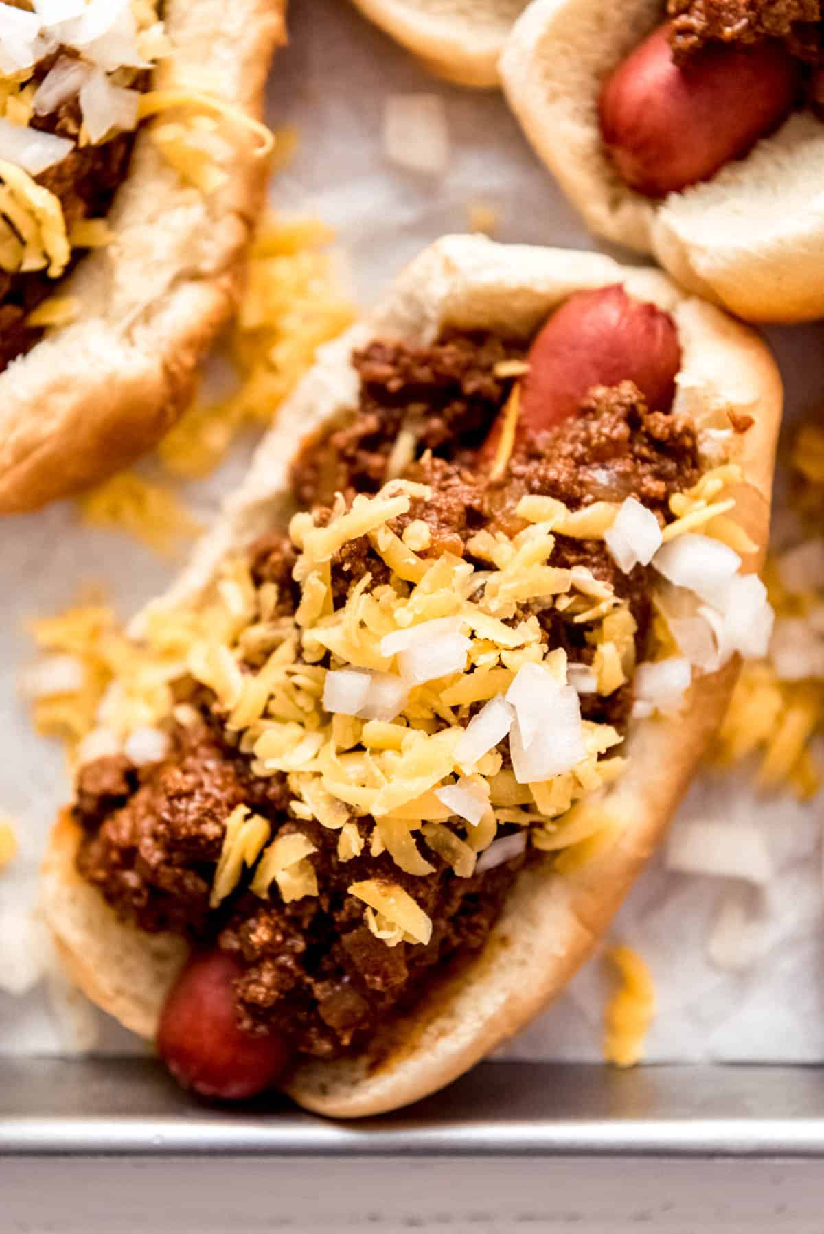 Coney Dog topped with meat sauce cheese and onions