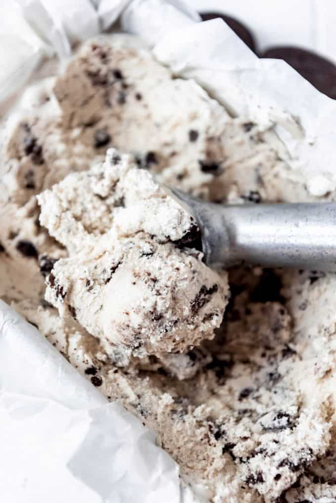 ice cream scoop dipping out a scoop of cookies and cream ice cream