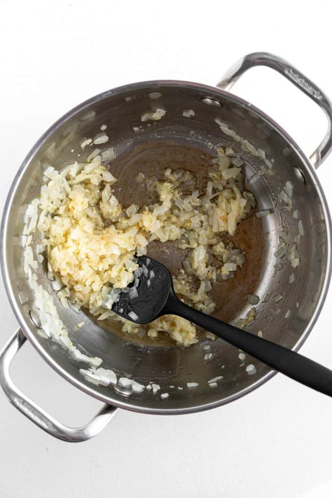 Sauteed onion, garlic, and ginger in a large pot.