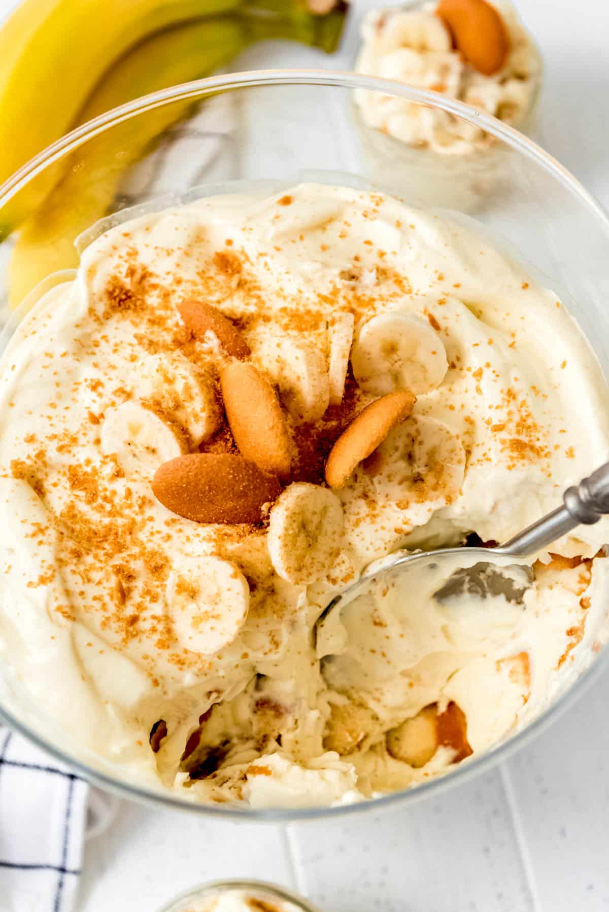 Taking a scoop out of magnolia bakery banana pudding with a silver spoon