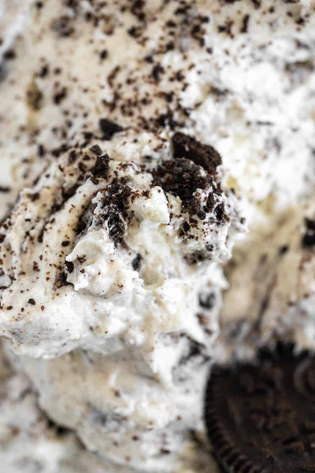 Close up view of the sweet Oreo dip, with cookie chunks visible. 