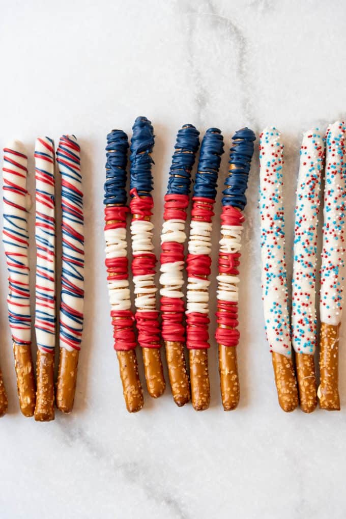patriotic pretzel rods decorated with melted chocolate and sprinkles
