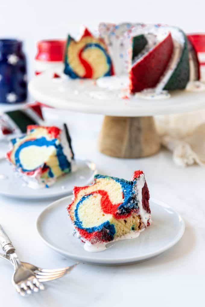 slices of red, white, and blue swirled bundt cake on plates