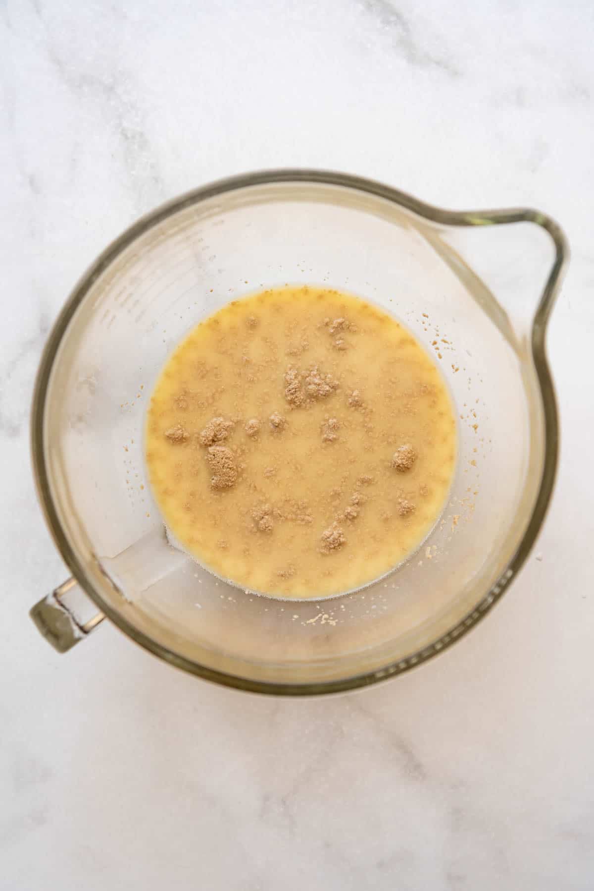 Proofing yeast in a large glass bowl.