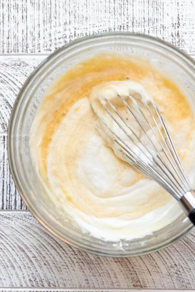 Whisking fluffy egg whites into Japanese pancake batter