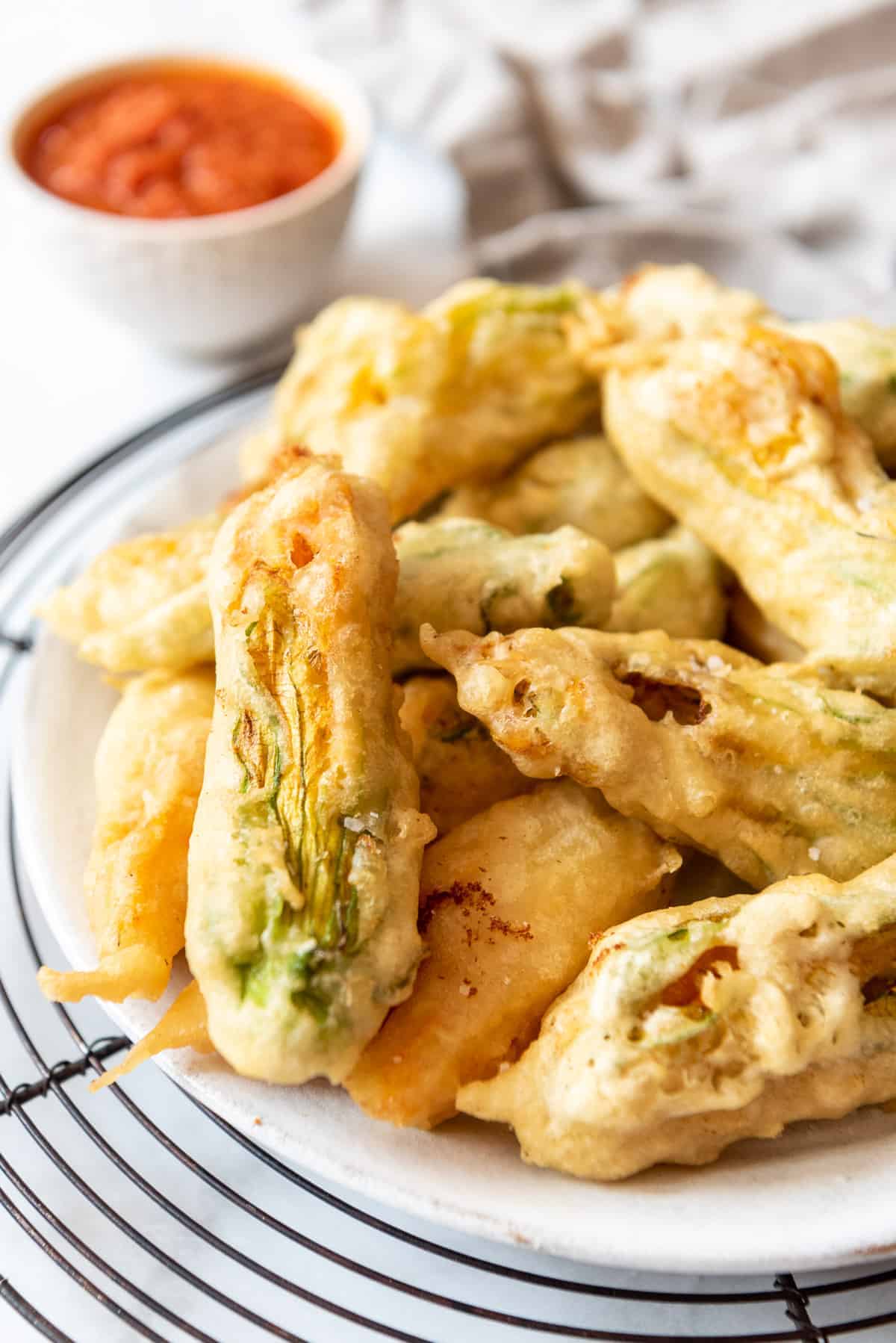 An image of fried squash blossoms stuffed with goat cheese.