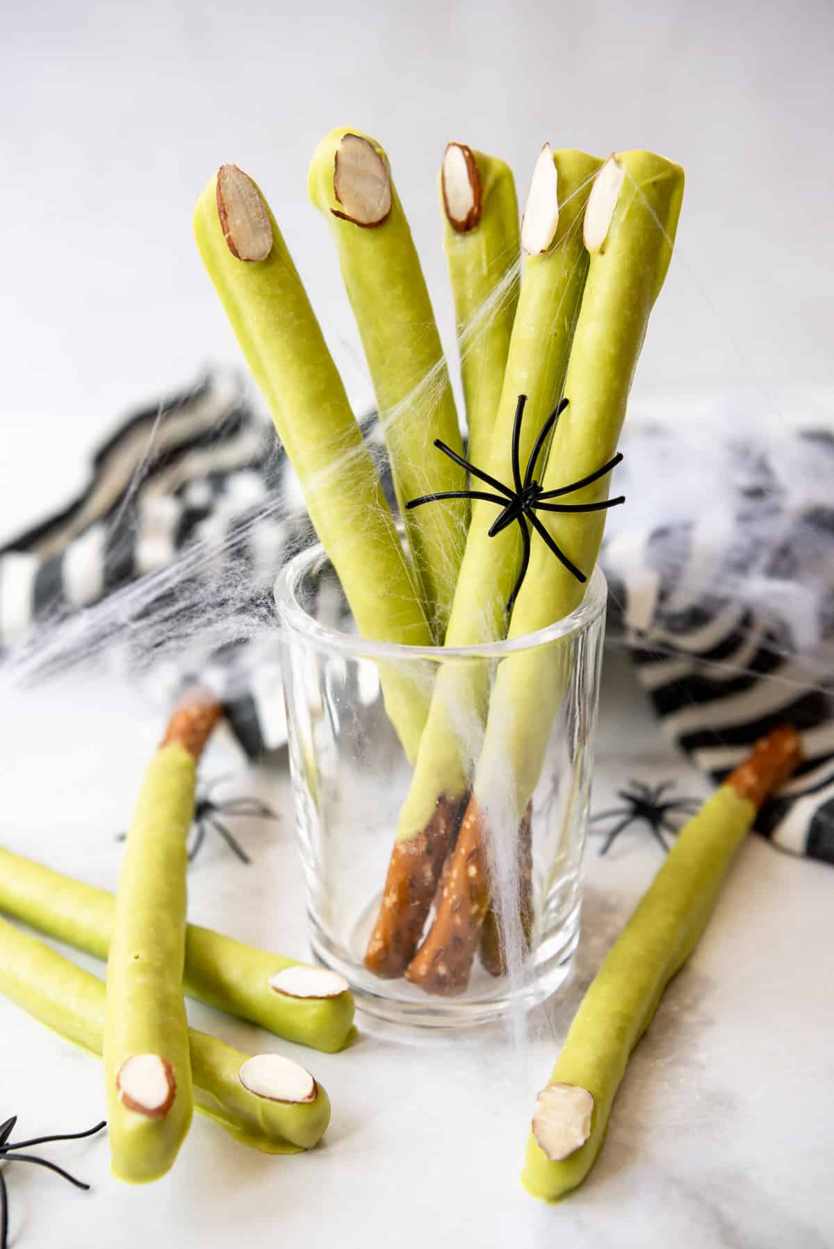 Green chocolate covered pretzels decorated like witch's fingers.